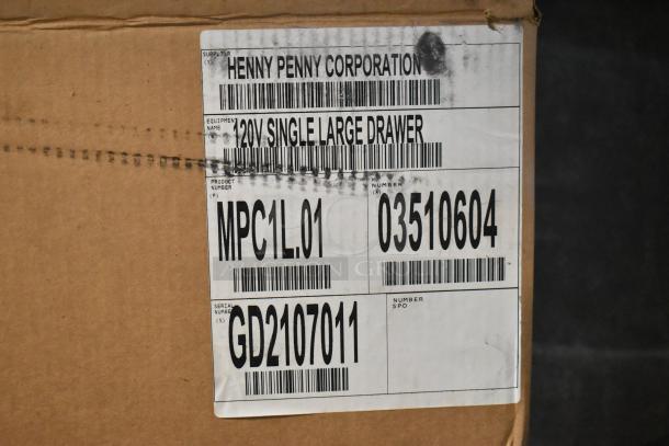 Brand new Henny Penny MPC-1L stainless steel holding bin in box. 110V, 1 phase. Label shows model and serial numbers.