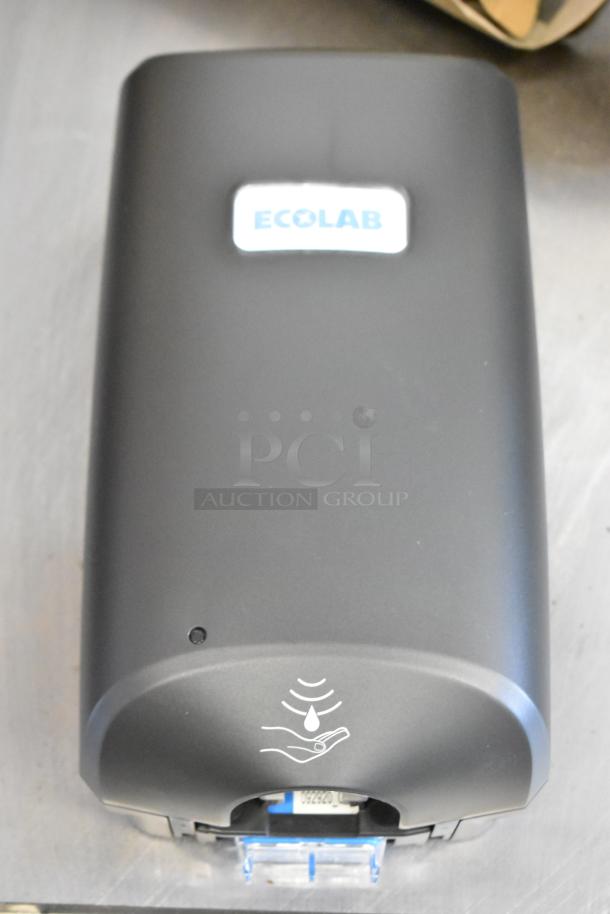4 new Ecolab Nexa Classic touch-free hand hygiene dispensers in box; sleek design, brand logo visible, ideal for hygiene needs.