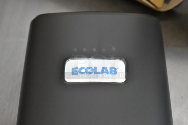 Ecolab Nexa Classic Touch Free Hand Hygiene Dispenser, brand new in box, sleek black design, Ecolab logo visible.