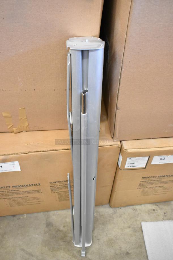 Retractable easel in silver with cardboard boxes; auction includes 2 soft bags. Good condition, compact storage.
