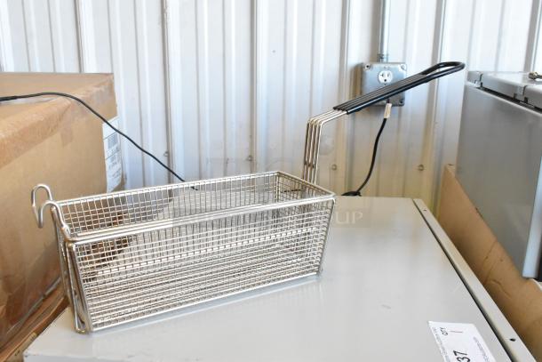 Brand new metal fry basket with long handle and mesh design, perfect for commercial kitchen use.