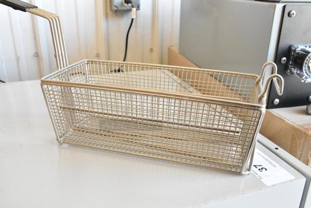 Brand new metal fry basket with sturdy wire mesh, heat-resistant handle, and hooks for easy hanging. Ideal for commercial use.
