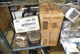 Brand new Steelton 18"x24" chrome 5-shelf kit and 3306-BK 2 oz punch ladle boxes on a shelf. Tags visible.