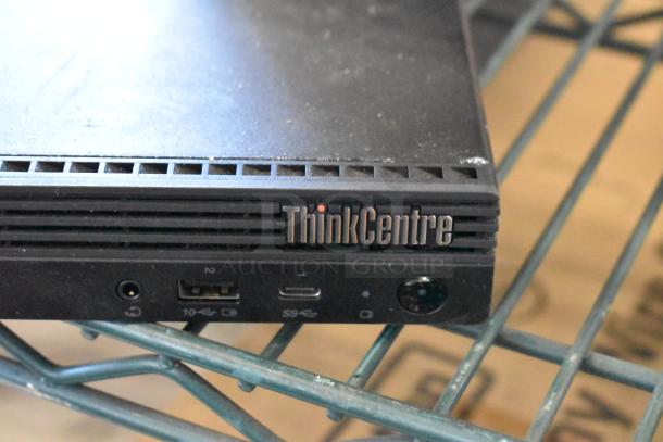 Lenovo ThinkCentre 11DN desktop front view. Features USB and audio ports. Part of a tech lot with monitor, printer, and keyboard.