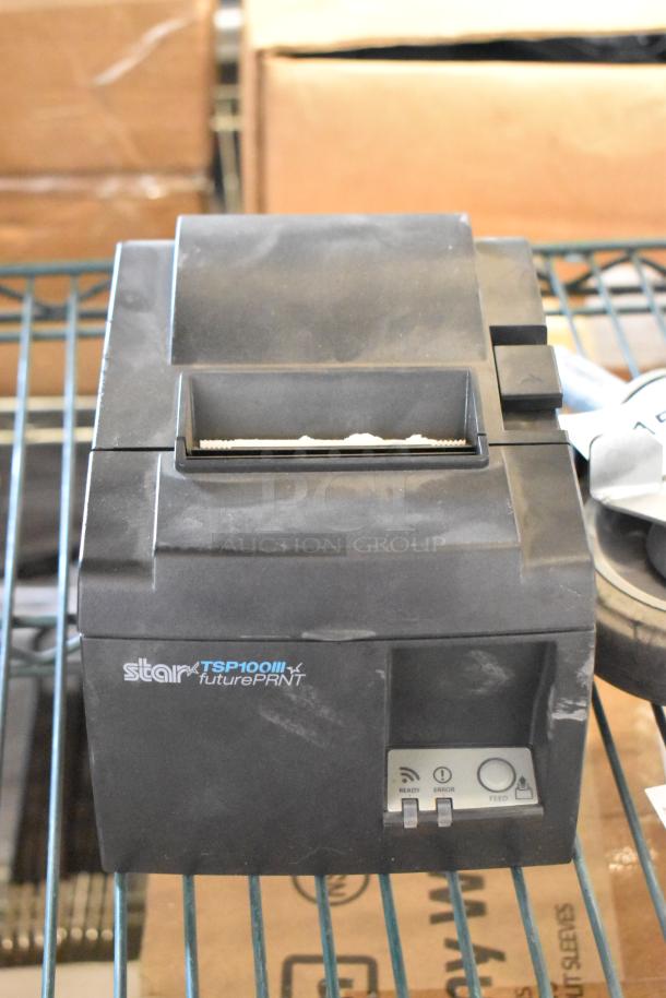 Star TSP100III receipt printer, black, visible logo, front control panel, used condition, part of a technology lot.