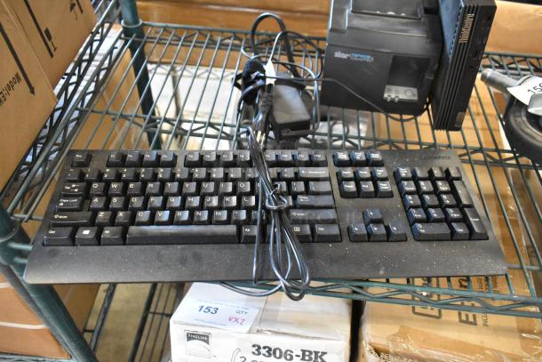 Lot of office equipment includes Element EM2FPAB24B monitor, Star TSP100III receipt printer, Lenovo keyboard and ThinkCentre 11DN desktop.