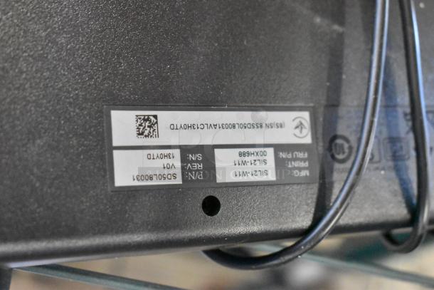 Label on the Lenovo ThinkCentre desktop showing serial number, part number, and revision information.