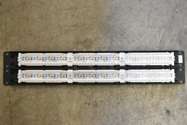 Tripp Lite 48 Port Panel, Cat.6, black frame, labeled ports with color coding, excellent condition, ideal for network setups.