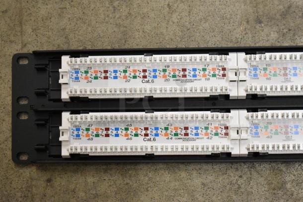 Tripp Lite 48 Port Panel, Cat 6, new, with clear labeling for T568A/T568B wiring, durable black bracket.