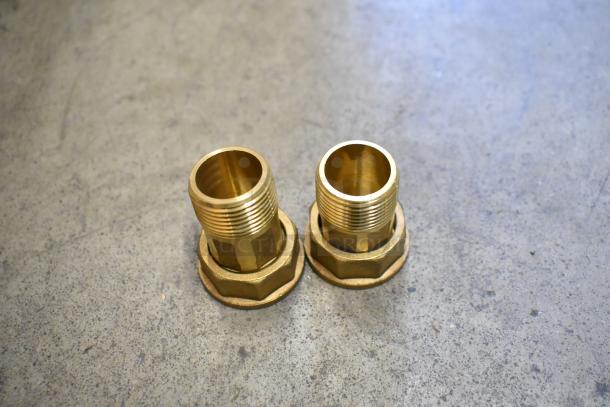 Two brass fittings on a concrete surface, not related to the EKM-PGM.75 Electric Meter listing described.