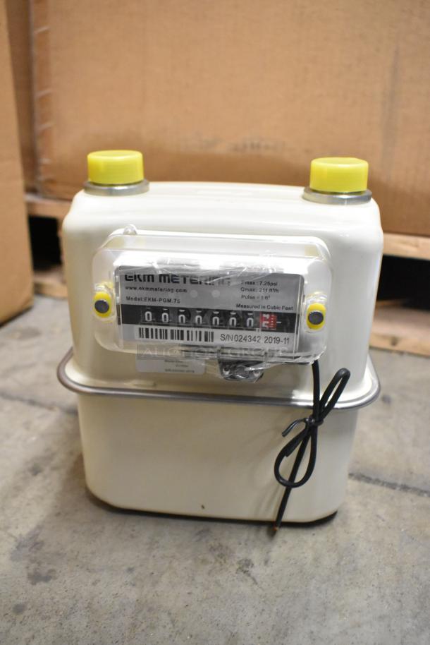 Brand new EKM Metering EKM-PGM.75 electric meter in box, model details and serial number visible.