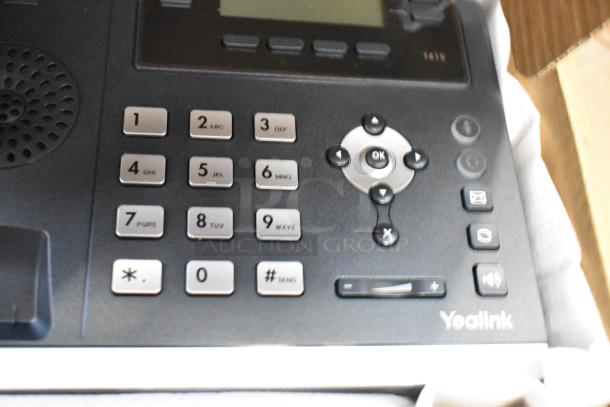 BRAND NEW SIP-T41S Ultra Elegant IP Phone, Yealink, in original packaging, featuring a sleek keypad and navigation buttons.