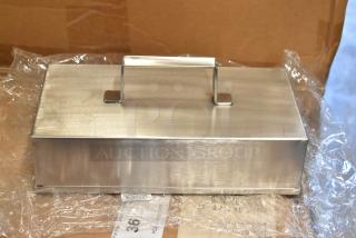 Brand new Don 1177876 metal basting cover, rectangular shape, stainless steel finish, handle on top, pristine condition. Box included.