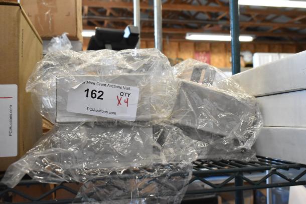 4 brand new Don 1177876 metal basting covers in box, wrapped in plastic, auction tag showing quantity 4.