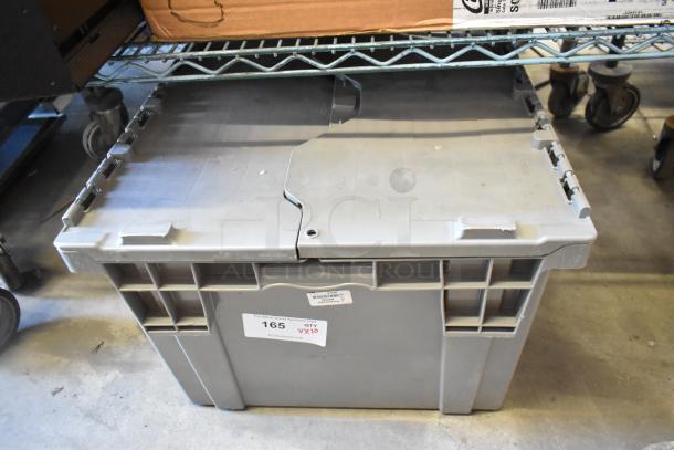Box of 10 brand new items, including Avigilon VMA-ENVR1-8P8, Cradlepoint. Labeled "165 QTY 10" on front.