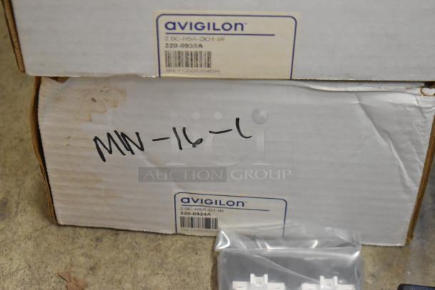 Lot of 10 new items including Avigilon VMA-ENVR1-8P8 and Cradlepoint, in original packaging with visible labeling.