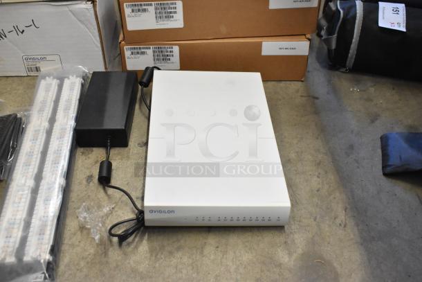 Lot of 10 brand new items including Avigilon VMA-ENVR1-8P8 unit. Includes original packaging and components.