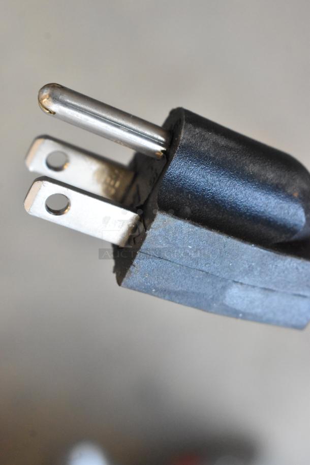 Close-up of a black electrical plug from Mars LPV236-1UA-OB Air Curtain Low Profile, 115 volts, for 1 phase use.