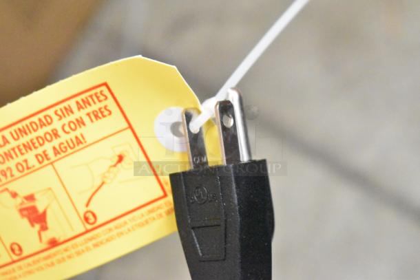 New Curtis SCCAFE0AP10A000 coffee brewer plug with yellow instruction tag attached.