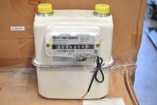 Brand new EKM Metering EKM-PGM.75 electric meter, in box, measures in cubic feet, model details visible on label.