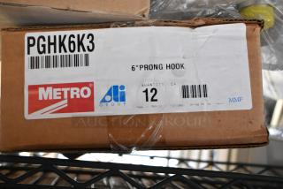 Box of 12 brand new Metro PGHK6K3 6" prong hooks, labeled with Metro and Ali Group logos.