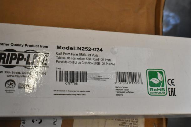 Tripp Lite N252-024 Cat6 Patch Panel, 568B, 24 Port, brand new in box. RoHS compliant with visible model and SKU details.