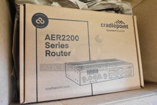 Brand new Cradlepoint AER2200 Series Router in original packaging, featuring NetCloud Service branding.