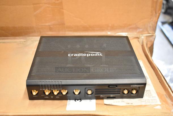 Cradlepoint AER2200 Series Router, brand new, with multiple connection ports, in original packaging.