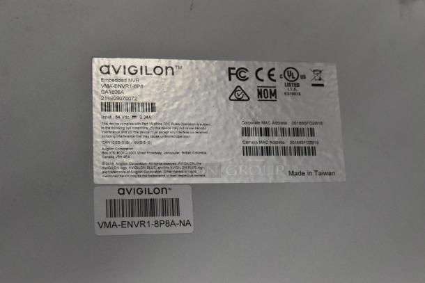 Label on Avigilon Embedded NVR VMA-ENVR1-8P8, displaying model, serial, and MAC addresses, marked "Made in Taiwan."