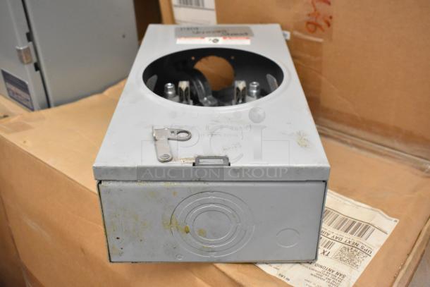 Talon Meter Socket, silver finish, pre-owned, circular cutout on top, minor wear visible, key mechanism included.
