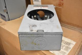 Talon Meter Socket, silver finish, pre-owned, circular cutout on top, minor wear visible, key mechanism included.