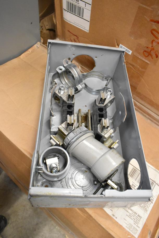 Talon Meter Socket, used condition, metal casing, visible clamps and connectors, partial label on side.
