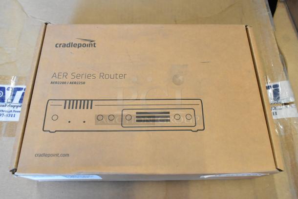 Brand new Cradlepoint AER Series Router in box, featuring AER2200/AER2250 models, unopened and sealed packaging.