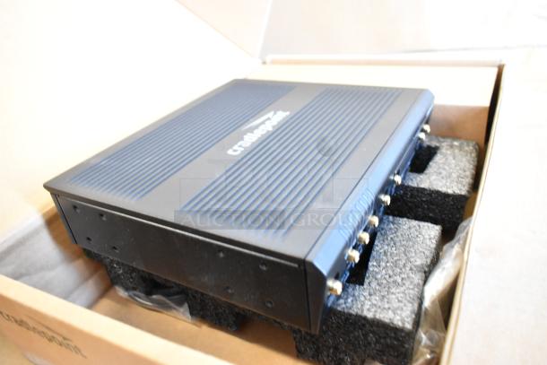 Brand new Cradlepoint AER Series Router in box, featuring robust design, secure mounting foam, and visible product labeling.