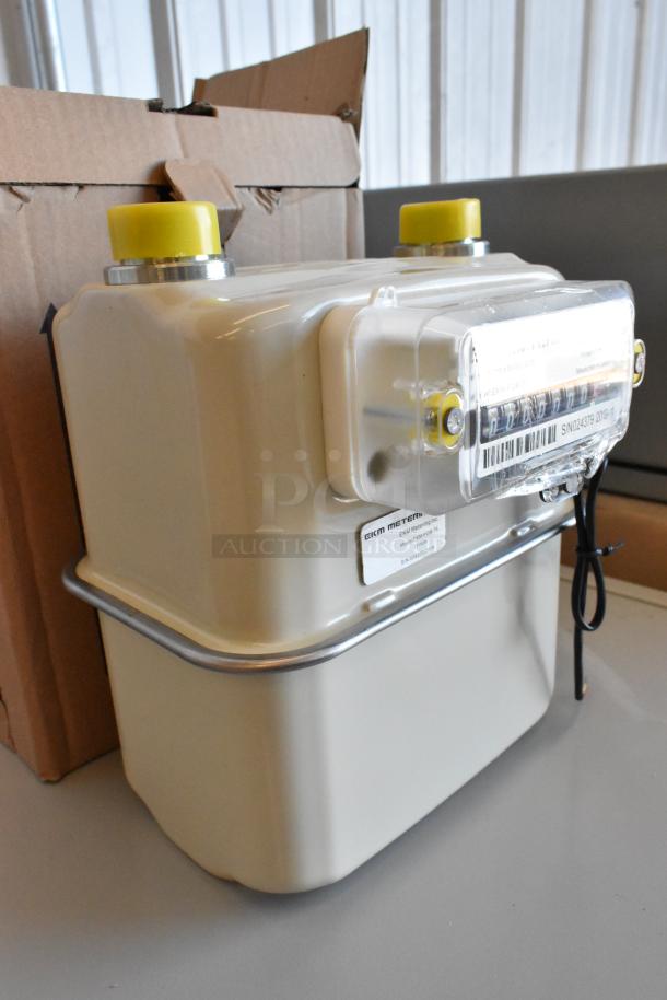 Brand new EKM Metering EKM-PGM.75 electric meter in box. Serial No.: SN042379 2019. Cream casing with yellow caps.