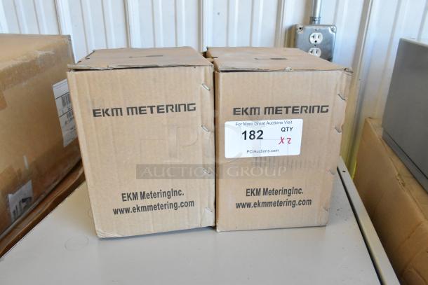 Two brand new EKM Metering EKM-PGM.75 electric meters in original boxes, labeled for auction lot 182, quantity 2.