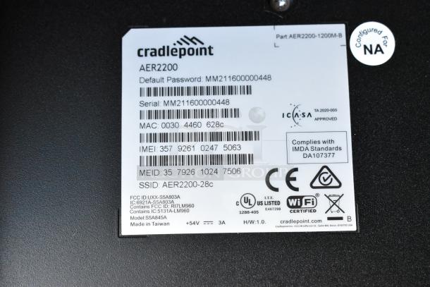Cradlepoint AER2200 router label showing serial number, default password, MAC, IMEI, and compliance markings.