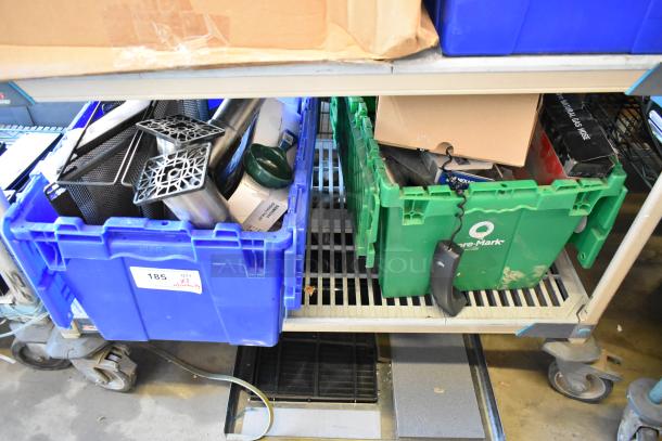 Two poly bins containing assorted items including wires, metal legs, a router, tape dispenser, and a timer. Bins are of different colors, with labels visible indicating quantity.