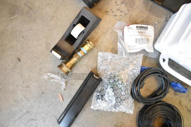 Two poly bins with assorted items: wires, tape dispenser, brass fitting, black router, timer, Marvico label, bubble wrap.