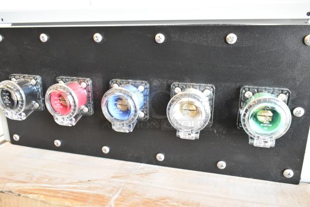Brand new Power Assemblies gray metal box with five color-coded plug connectors, securely mounted to a black panel.