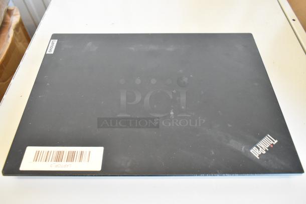 Lenovo ThinkPad laptop with visible ThinkPad logo, matte black finish, and barcode label; part of 11-laptop auction set.