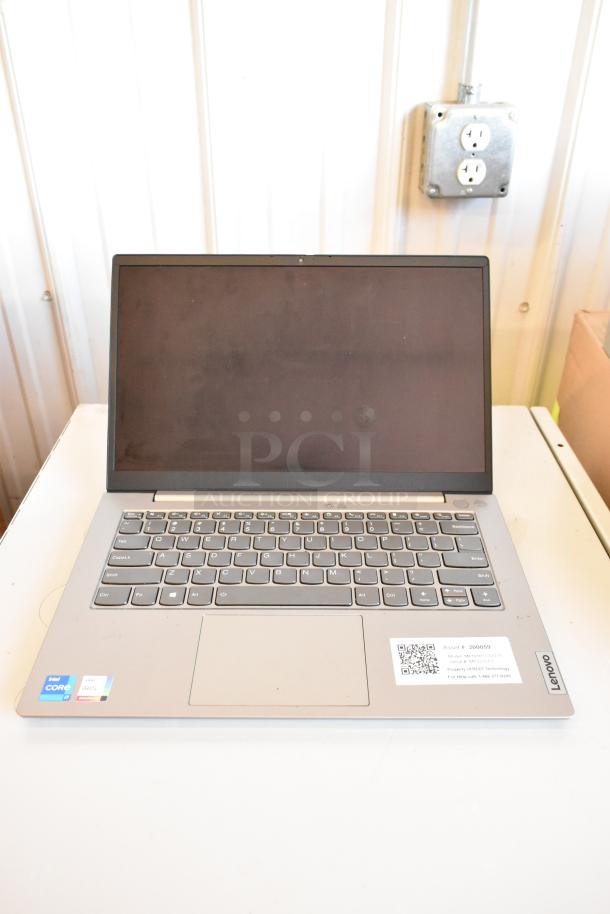 Lenovo laptop with Intel Core i5 and Iris Xe graphics stickers. Asset ID: 200959. Model: M2031-11111YR. Gray keyboard.