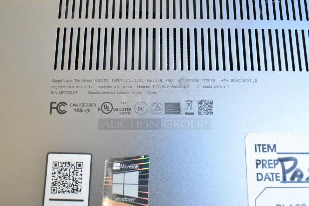 Lenovo ThinkBook 14 G2 ITL laptop base showing model, serial number, manufacturing date, and compliance logos.