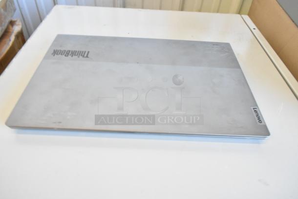 11 Lenovo, Dell, HP laptops on auction. Includes ThinkPad with visible logo. Condition shows signs of wear.