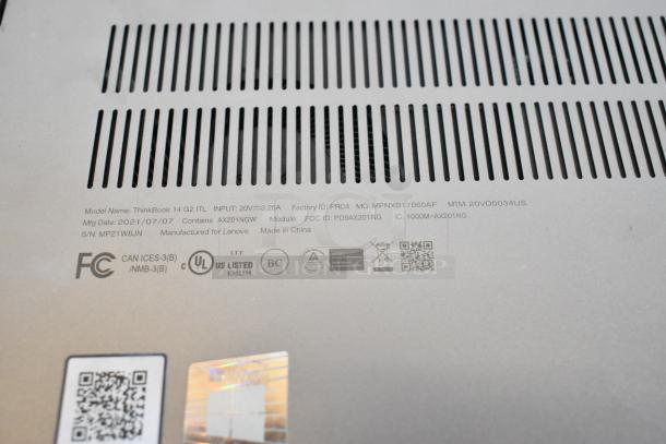 Close-up of Lenovo ThinkBook 14 G2 ITL laptop label showing model details and manufacturing info, highlighting key specifications.
