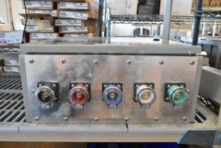 Power Assemblies gray metal box with colored connectors, 120/208 volts, 3-phase. Appears used, on warehouse shelf.