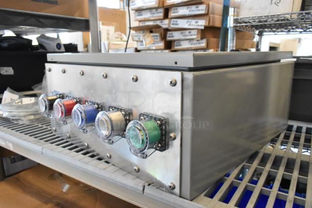 Power Assemblies gray metal box, 120/208 volts, 3 phase. Features multiple color-coded connectors. Appears in used condition.