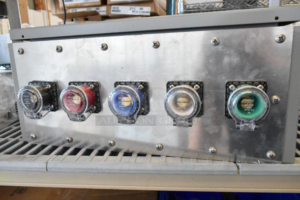 Power Assemblies gray metal box, 120/208 volts, 3 phase. Five color-coded outlets on front panel, used condition.