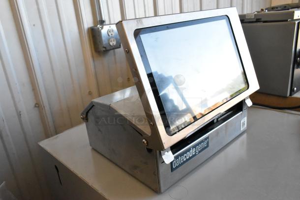 Date Code Genie DCGX2 Label Printer, stainless steel body, front panel display, used condition, visible brand label.