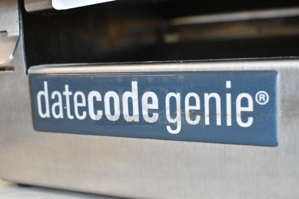 Date Code Genie DCGX2 Label Printer, stainless steel, close-up of logo, modern design, appears in good condition.